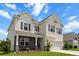 Charming two-story home features a welcoming front porch, attached garage, and classic curb appeal at 2746 Sunrose Ln, Johns Island, SC 29455