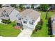 Inviting front porch with cozy seating, decorative accents, and charming brickwork at 2746 Sunrose Ln, Johns Island, SC 29455