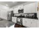 Modern kitchen with white cabinetry, stainless steel appliances, and granite countertops at 2746 Sunrose Ln, Johns Island, SC 29455