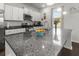 Kitchen island with granite countertop and stainless steel appliances at 2746 Sunrose Ln, Johns Island, SC 29455