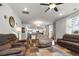 Open-concept living room featuring hardwood floors, neutral walls, and sliding door access at 2746 Sunrose Ln, Johns Island, SC 29455