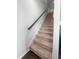 Carpeted stairway with wooden handrail leading to the upper level of the home at 2746 Sunrose Ln, Johns Island, SC 29455