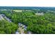 An aerial view showcases charming homes nestled among lush green trees and landscaping in this neighborhood at 3031 Ellington Dr, Summerville, SC 29485