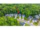 A charming two-story home is nestled among lush trees, with a driveway and well-kept lawn at 3031 Ellington Dr, Summerville, SC 29485