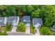 A charming two-story home is nestled among lush trees, with a driveway and well-kept lawn at 3031 Ellington Dr, Summerville, SC 29485
