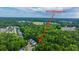 Aerial view of homes in the Ellington Dr neighborhood surrounded by trees and close to shopping at 3031 Ellington Dr, Summerville, SC 29485