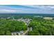 Aerial view showcasing homes with lush trees and foliage surrounding the neighborhood at 3031 Ellington Dr, Summerville, SC 29485