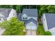 A charming two-story home is nestled among lush trees, with a driveway and well-kept lawn at 3031 Ellington Dr, Summerville, SC 29485