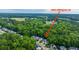 Aerial view of homes in the Ellington Dr neighborhood surrounded by trees and close to shopping at 3031 Ellington Dr, Summerville, SC 29485