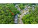 An overhead shot shows homes adjacent to an area of dense, green forest at 3031 Ellington Dr, Summerville, SC 29485
