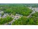 Aerial view showcases homes nestled in a lush, green, wooded neighborhood at 3031 Ellington Dr, Summerville, SC 29485