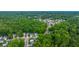 Overhead shot of a residential neighborhood surrounded by lush green trees at 3031 Ellington Dr, Summerville, SC 29485
