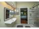 Elegant bathroom with a walk-in shower, modern fixtures, and a bright vanity at 3031 Ellington Dr, Summerville, SC 29485