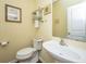 Cozy half bathroom with pedestal sink, wood look floors and decorative wall art at 3031 Ellington Dr, Summerville, SC 29485