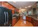 Updated kitchen boasts stainless steel appliances, granite countertops, and hardwood flooring at 3031 Ellington Dr, Summerville, SC 29485