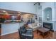 Open-concept living room with hardwood floors, fireplace, and eat-in kitchen at 3031 Ellington Dr, Summerville, SC 29485