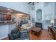 Open-concept living room featuring a fireplace, hardwood floors, and ample natural light from large windows at 3031 Ellington Dr, Summerville, SC 29485