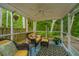 Comfortable screened porch with outdoor furniture, ceiling fan, and view of the backyard at 3031 Ellington Dr, Summerville, SC 29485