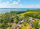 Stunning aerial view of waterfront homes, lush green landscape and blue skies on a sunny day at 305 Whitewood Ct, Moncks Corner, SC 29461