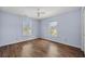 Comfortable bedroom featuring hardwood floors and bright windows at 305 Whitewood Ct, Moncks Corner, SC 29461