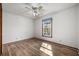 Bedroom with hardwood floors and a ceiling fan is brightly lit from the natural light of one window at 305 Whitewood Ct, Moncks Corner, SC 29461