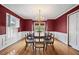 Formal dining room featuring hardwood floors, wainscoting, and elegant chandelier at 305 Whitewood Ct, Moncks Corner, SC 29461