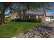 Charming two-story brick house with manicured front lawn and mature tree at 305 Whitewood Ct, Moncks Corner, SC 29461