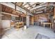 Garage with tools, work benches, storage, and open ceiling at 305 Whitewood Ct, Moncks Corner, SC 29461