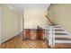 Hallway with hardwood floors, staircase, and a charming wooden dresser at 305 Whitewood Ct, Moncks Corner, SC 29461