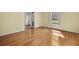 Spacious living room with hardwood floors, natural light, and neutral wall colors at 305 Whitewood Ct, Moncks Corner, SC 29461