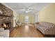 Cozy living room with brick fireplace, hardwood floors, and comfortable seating at 305 Whitewood Ct, Moncks Corner, SC 29461