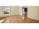 Bright living room with hardwood floors, large windows, and neutral wall colors at 305 Whitewood Ct, Moncks Corner, SC 29461