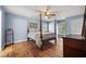 Comfortable main bedroom with hardwood floors, and ample natural light at 305 Whitewood Ct, Moncks Corner, SC 29461