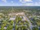 A bird's-eye perspective of a charming home nestled in a verdant, tree-filled urban landscape at 318 N Magnolia St, Summerville, SC 29483