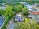 Aerial view of the property showcasing its well-manicured lawn, landscaping, and proximity to downtown at 318 N Magnolia St, Summerville, SC 29483