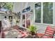 Inviting back deck with chairs, a table, and access to the house, creating a cozy outdoor living space at 318 N Magnolia St, Summerville, SC 29483