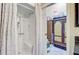 Bathroom featuring a stand-alone shower with curtains and a view into another room at 318 N Magnolia St, Summerville, SC 29483