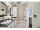Bathroom featuring double sinks, updated vanity, toilet, and storage for a functional and stylish space at 318 N Magnolia St, Summerville, SC 29483