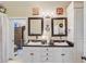Bathroom with double sinks, vanity, framed mirrors and decorative accents for a functional and stylish space at 318 N Magnolia St, Summerville, SC 29483