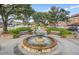 Picturesque fountain surrounded by benches and lush greenery in Summerville, South Carolina at 318 N Magnolia St, Summerville, SC 29483