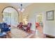 Spacious foyer with hardwood floors, arched entryway, and antique-style seating at 318 N Magnolia St, Summerville, SC 29483