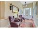 Inviting foyer featuring hardwood floors, vintage lighting, and classic decor at 318 N Magnolia St, Summerville, SC 29483