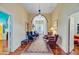 Hallway showcasing hardwood floors and antique style decor, flowing into other rooms at 318 N Magnolia St, Summerville, SC 29483