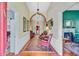 Elegant foyer with hardwood floors, decorative lighting, and a view of the living spaces at 318 N Magnolia St, Summerville, SC 29483