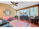 Cozy living room with hardwood floors, comfortable seating, and a television for relaxed entertainment at 318 N Magnolia St, Summerville, SC 29483