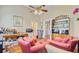 Office with two armchairs, workspace and storage, ceiling fan, and access to additional rooms and amenities at 318 N Magnolia St, Summerville, SC 29483