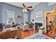 A home office featuring hardwood floors, a fireplace, and a desk, providing a functional workspace at 318 N Magnolia St, Summerville, SC 29483
