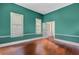 Bright, airy office with hardwood floors, natural light, and a view to adjoining spaces at 318 N Magnolia St, Summerville, SC 29483