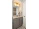 Bathroom vanity featuring a gray cabinet, marble countertop, and brushed nickel hardware at 34 Dereef Ct, Charleston, SC 29403