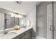 Modern bathroom with double sinks, marble countertops, and a spacious tiled shower, offering style and functionality at 34 Dereef Ct, Charleston, SC 29403
